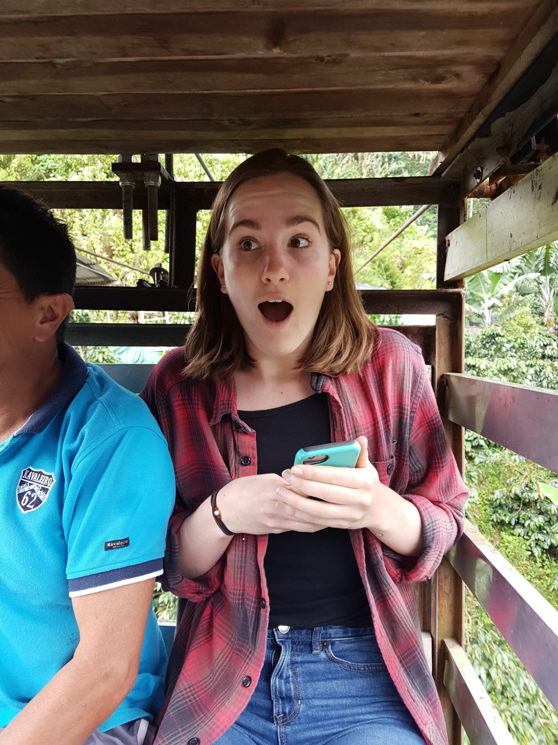 Surprised Traveler riding on the Garrucha (wooden cable car) in Jardin Colombia